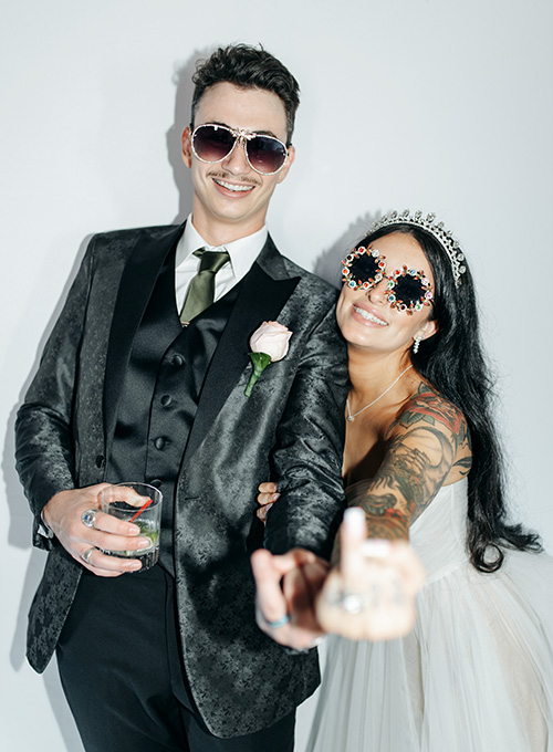Just married couple using our photo booth rental service